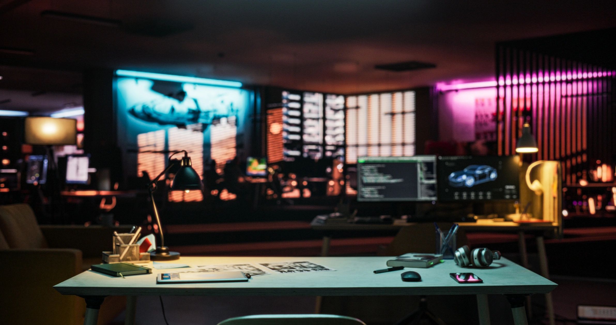 Creative office workspace illuminated with neon light